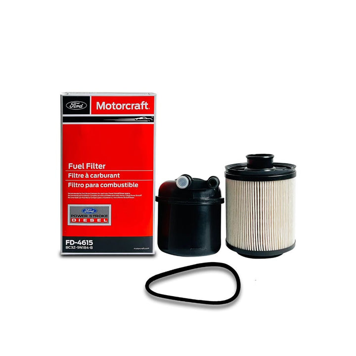 Motorcraft FD-4615 fuel filter kit showing OEM box, filter element, housing, and O-ring for Ford 6.7L Powerstroke diesel engines.